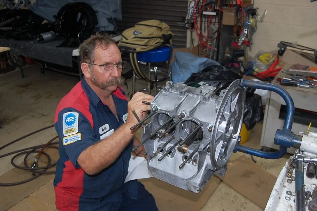 Technician working on an engine