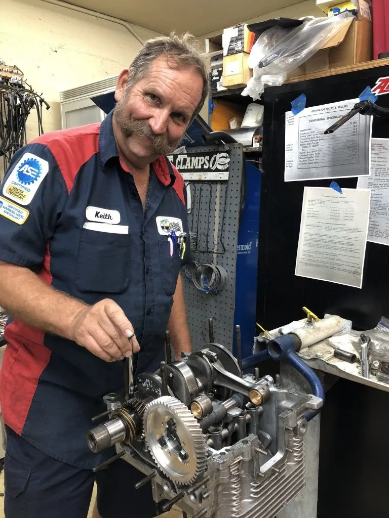 Keith Pershing with an engine in the shop